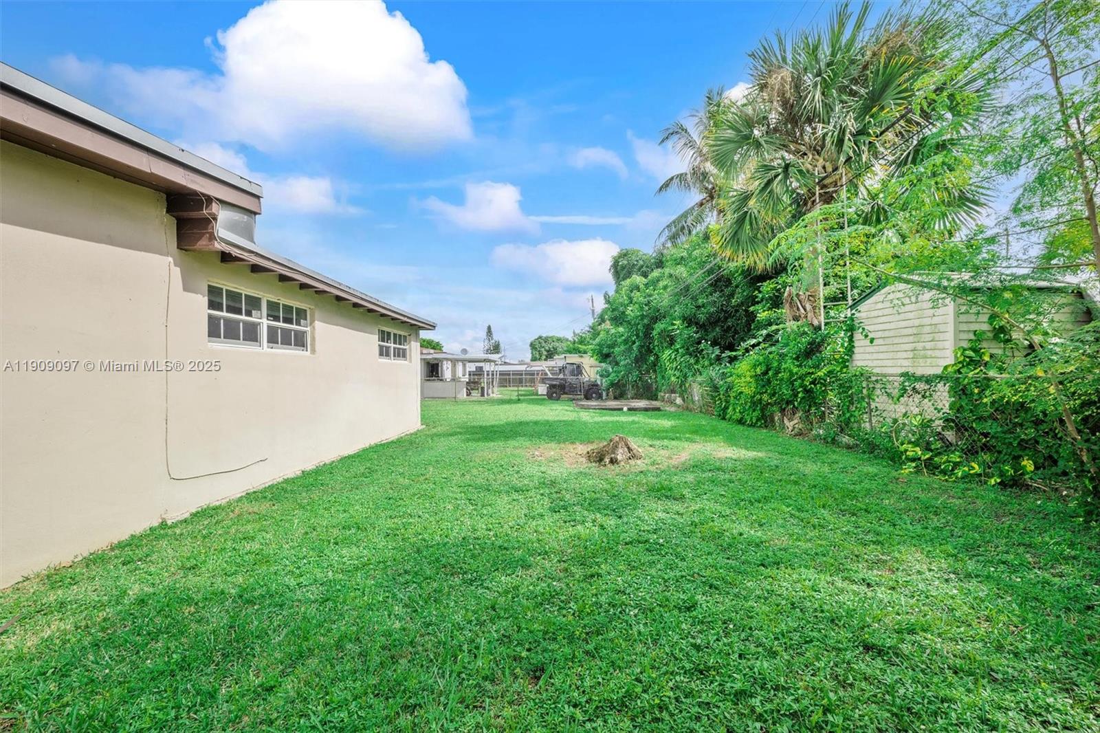 1960 Northwest 187th Street Miami Gardens, FL 33056 - Photo 15 of 23 a view of a backyard with plants and a garden