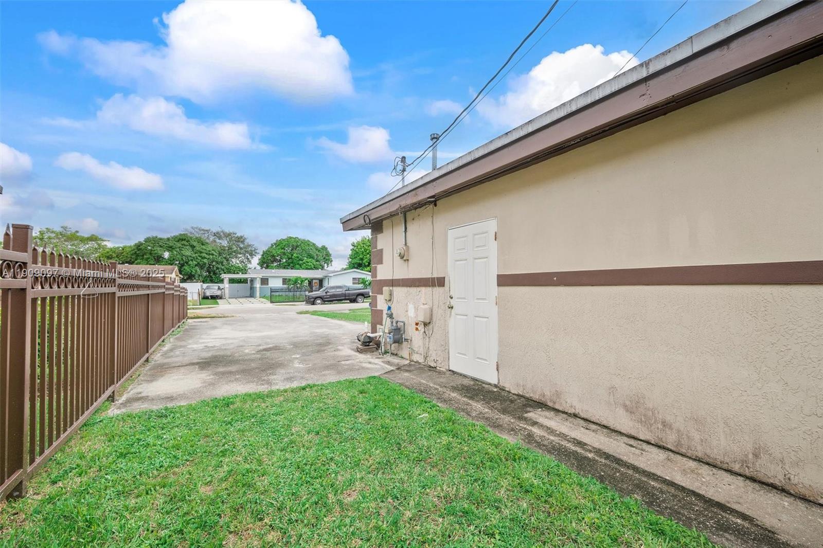 1960 Northwest 187th Street Miami Gardens, FL 33056 - Photo 16 of 23 a view of a backyard with wooden fence