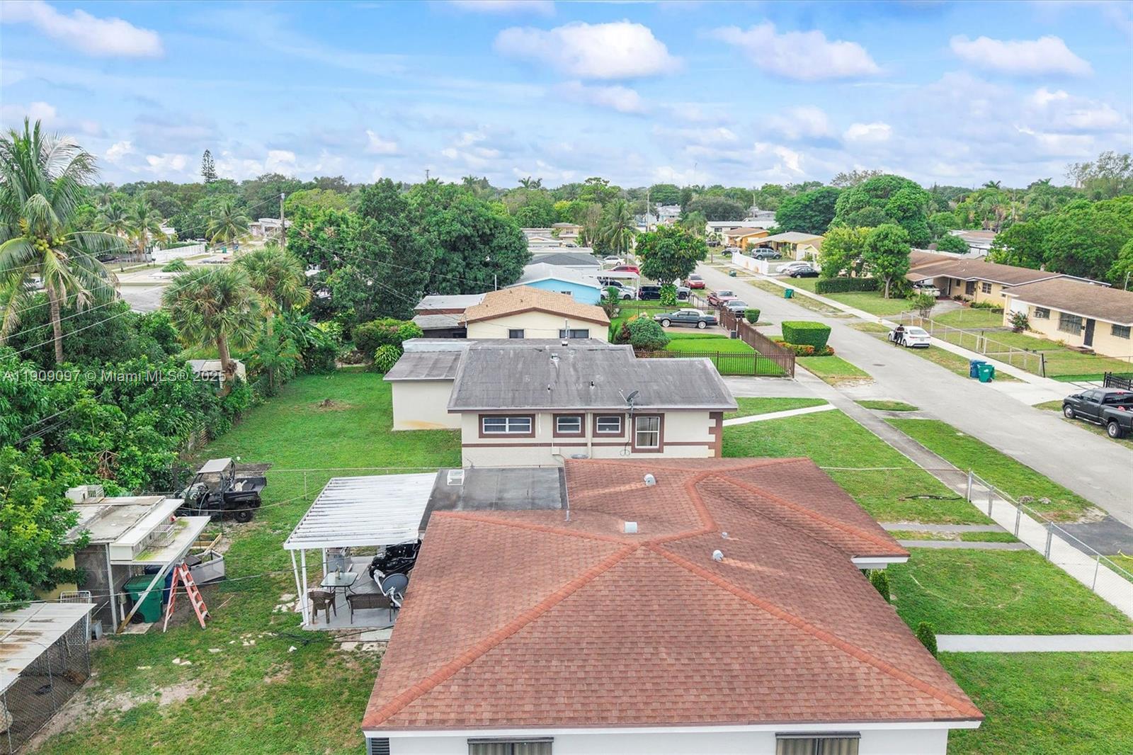 1960 Northwest 187th Street Miami Gardens, FL 33056 - Photo 18 of 23 an aerial view of a house with a garden
