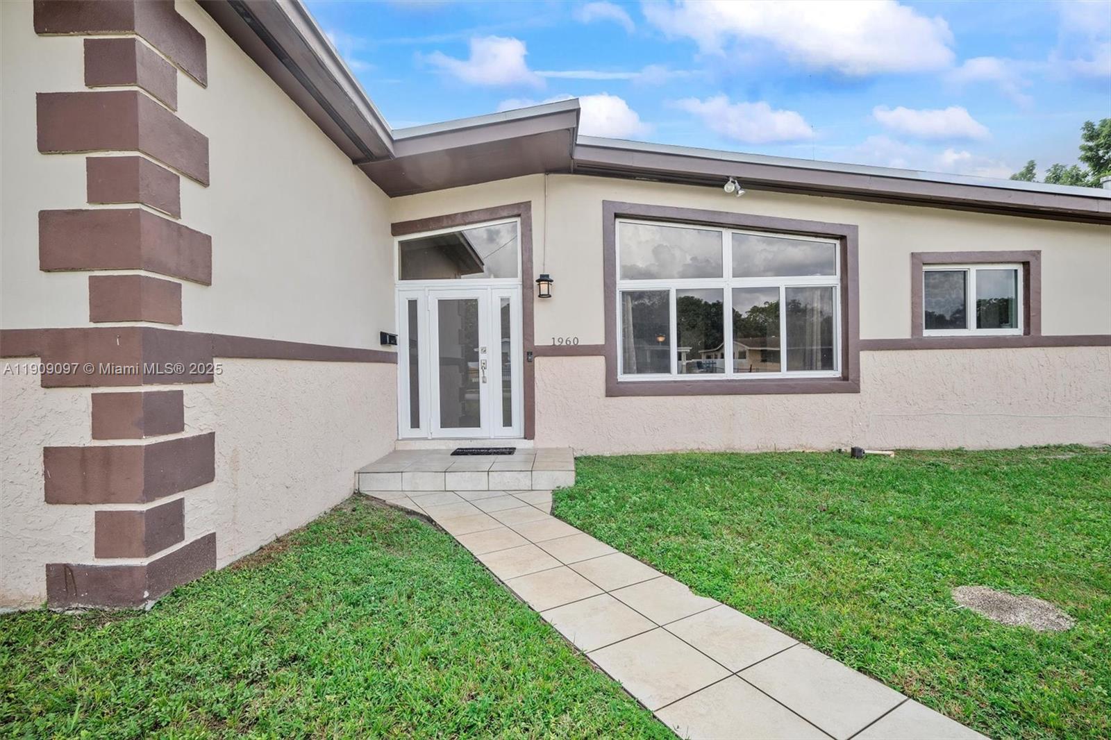 1960 Northwest 187th Street Miami Gardens, FL 33056 - Photo 2 of 23 a view of back yard of the house