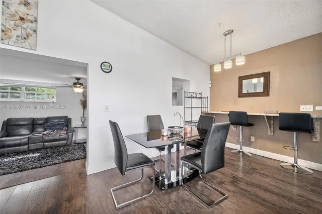 a view of a livingroom with furniture and a window