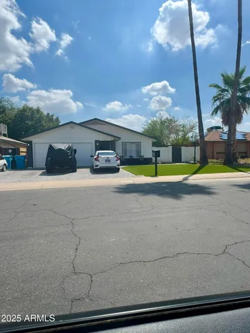 a view of a swimming pool with an outdoor space and seating area