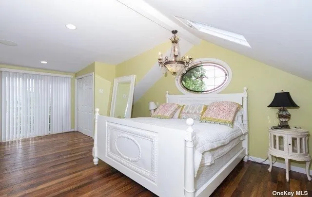 a bedroom with a bed and a table in it