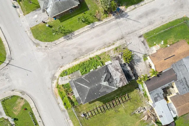 an aerial view of a house with a yard and a garden