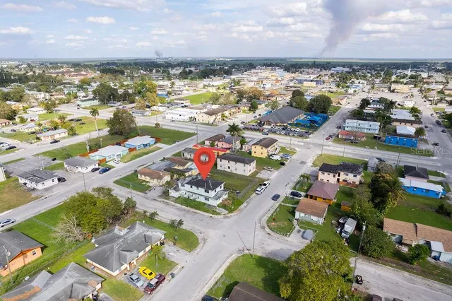 an aerial view of residential houses with outdoor space
