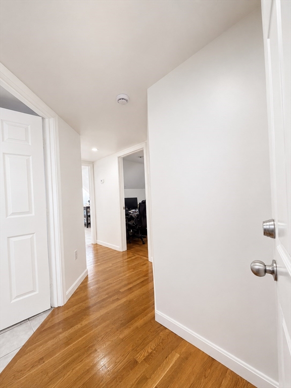 5 Myrtle Street, Unit 3 Saugus, MA 01906 - Photo 2 of 15 a view of a hallway with wooden floor