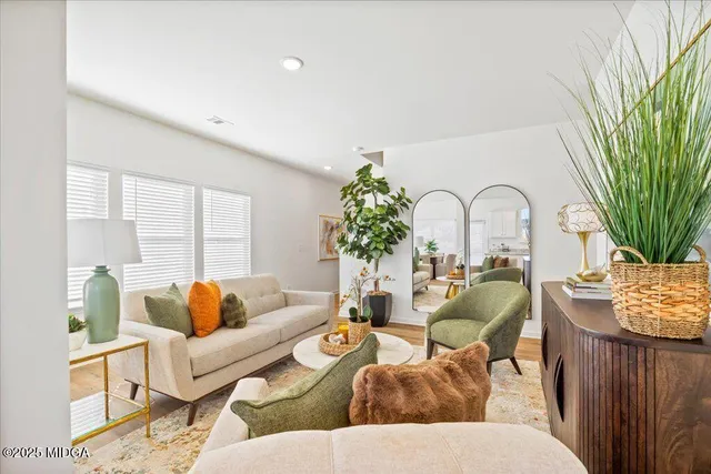 a bathroom with a sink mirror and toilet