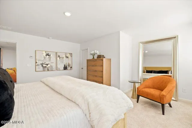 a bedroom with a bed and a lamp