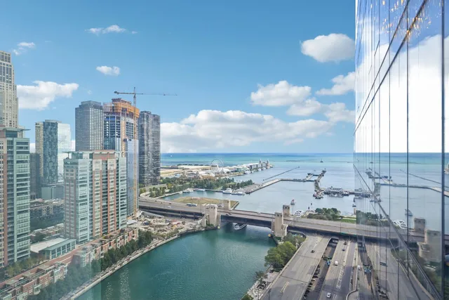 a view of a lake with tall buildings