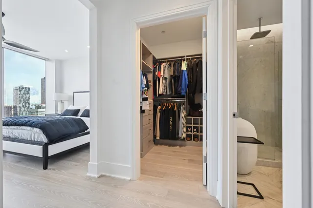 a bedroom with a bed and a mirror