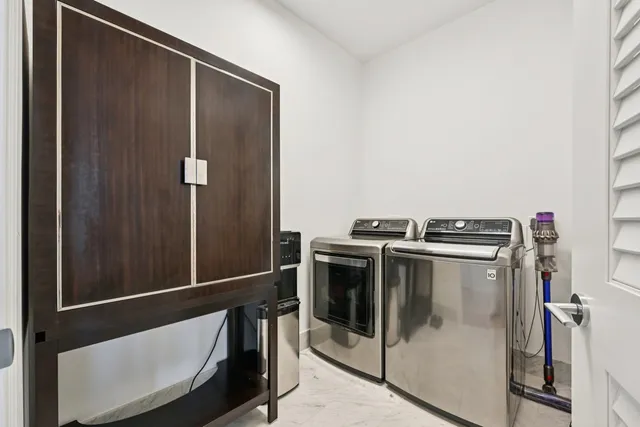 a utility room with dryer and washer