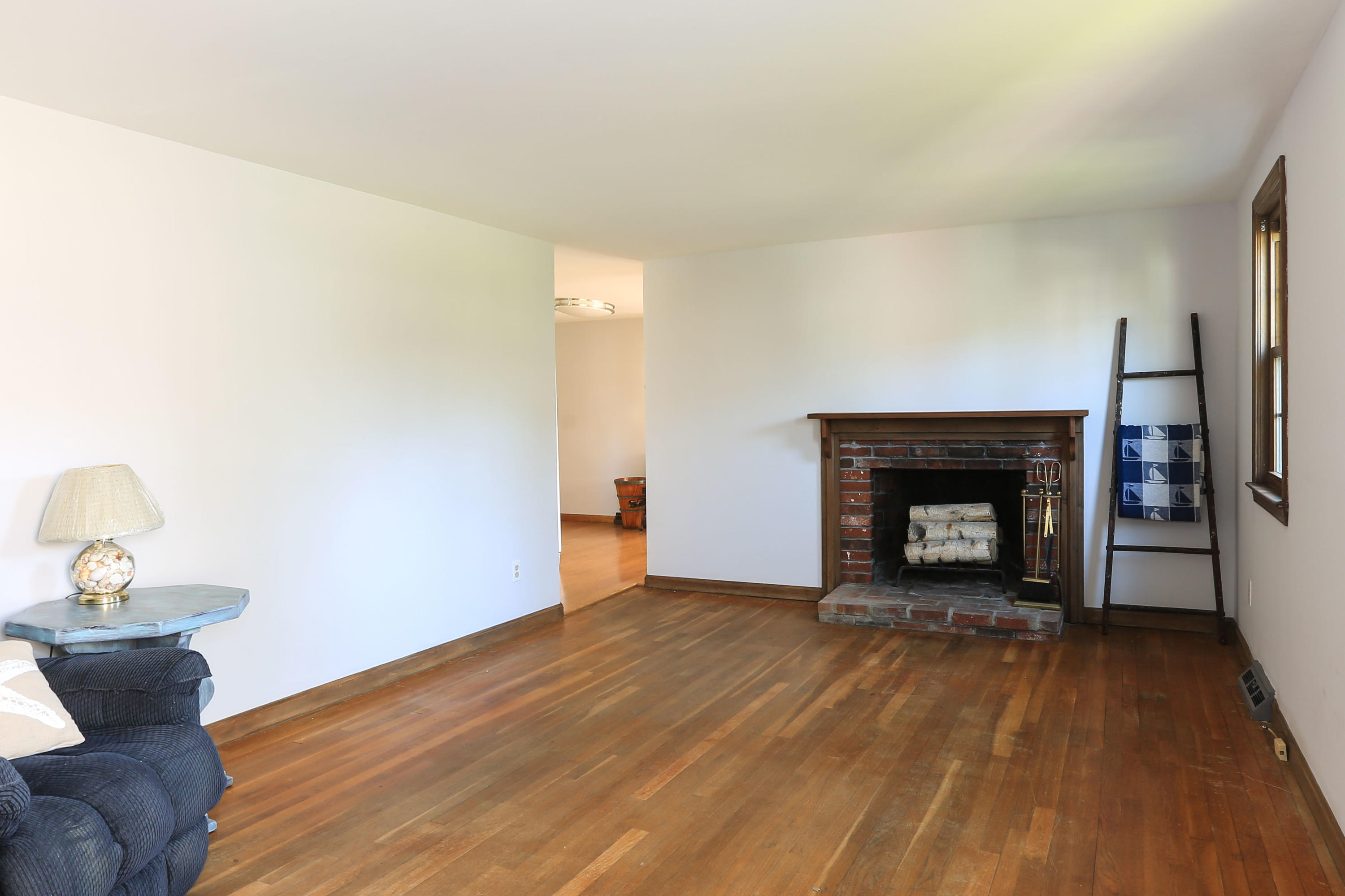 35 Gunwale Road West Hyannis Port, MA 02601 - Photo 11 of 21 a view of empty room with wooden floor and fireplace