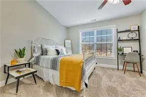 a bedroom with a bed and a chair