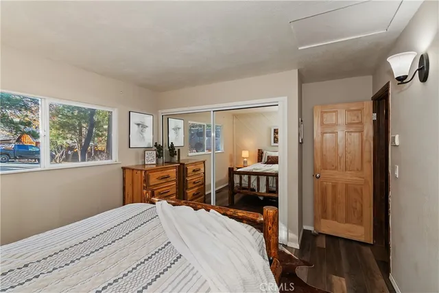a roof deck with table and chairs under an umbrella