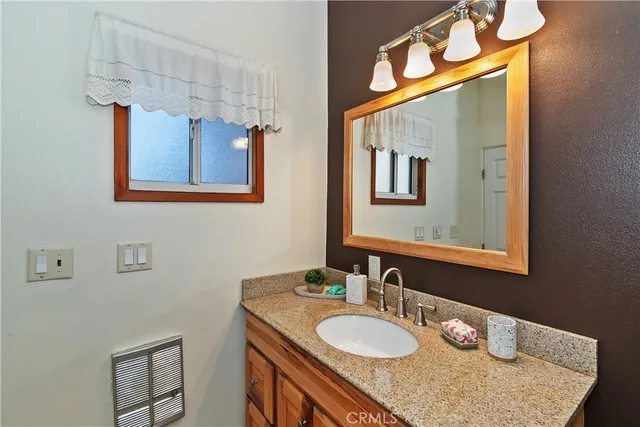 a bathroom with a shower curtain and a curtain