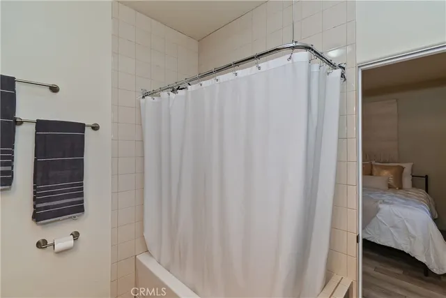 a view of a yard with wooden fence