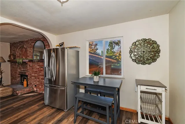 a kitchen with stainless steel appliances a refrigerator and a stove