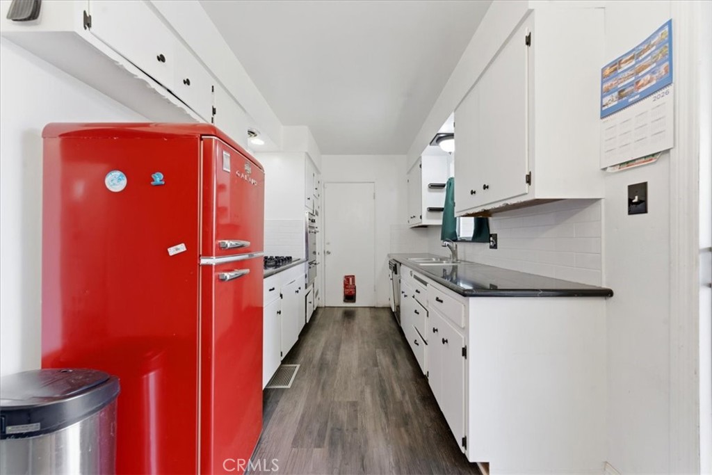 34863 Wildwood Canyon Road Yucaipa, CA 92399 - Photo 7 of 22 a kitchen with stainless steel appliances granite countertop a sink stove and refrigerator