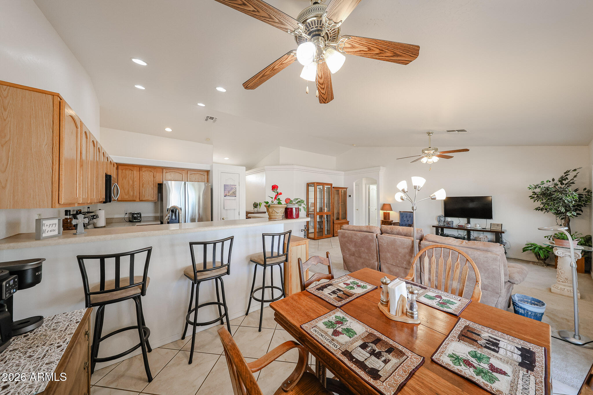 14980 South Capistrano Road Arizona City, AZ 85123 - Photo 8 of 39 a view of a dining room with furniture a kitchen and chandelier