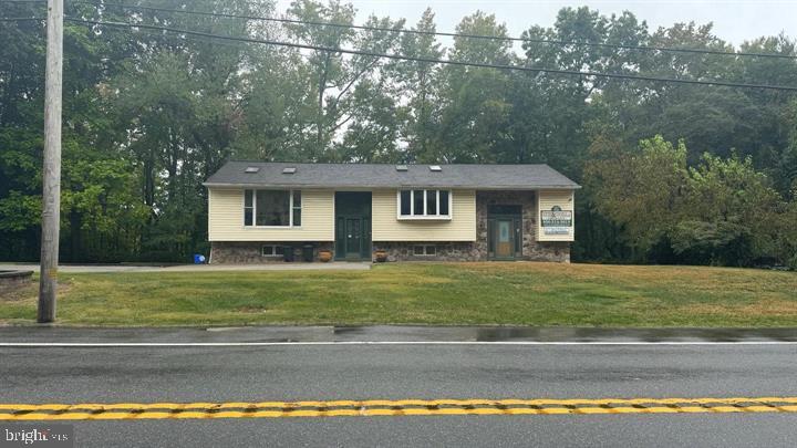 714-720 Harding Highway Carneys Point, NJ 08069 - Photo 12 of 42 a front view of a house with a garden