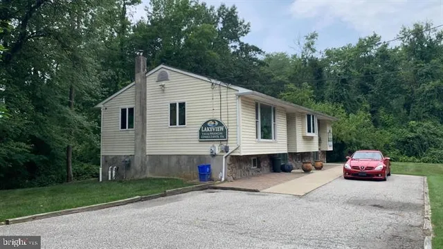 a view of a house with a yard