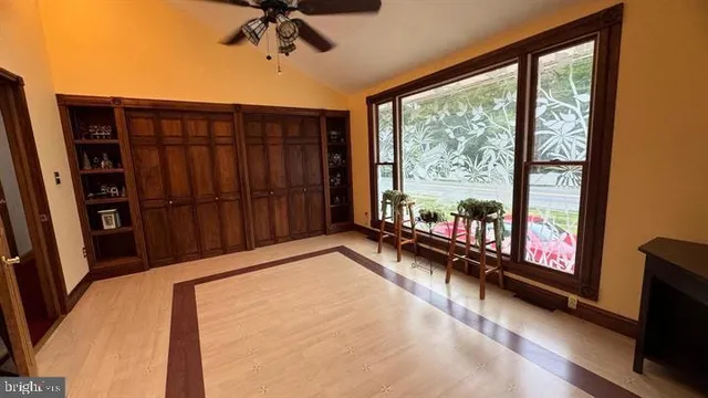 a view of a hardwood floor and a ceiling window