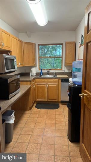 714-720 Harding Highway Carneys Point, NJ 08069 - Photo 29 of 42 a kitchen with a sink stove and cabinets