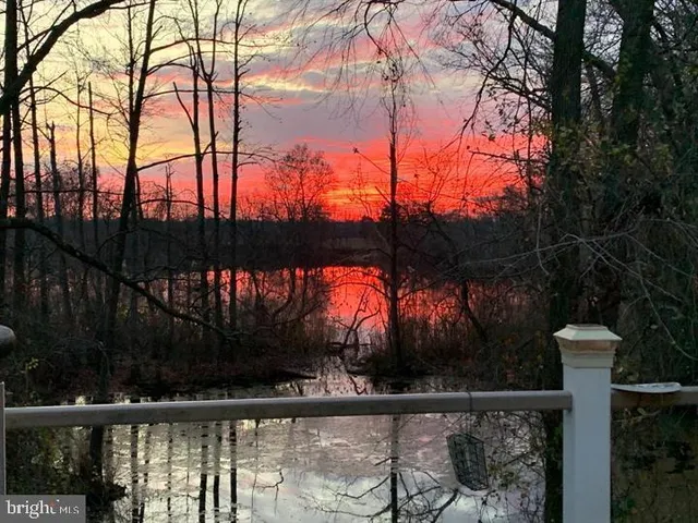 a view of swimming pool with outdoor seating
