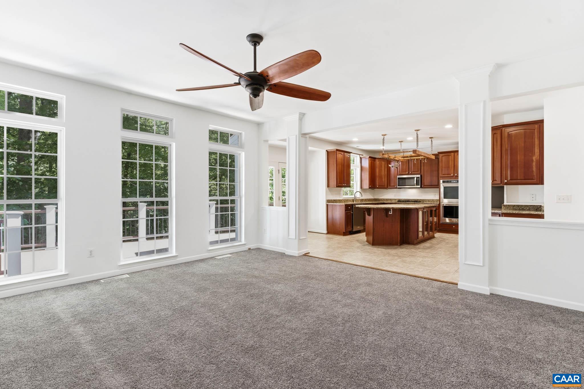 700 Rainier Road Charlottesville, VA 22903 - Photo 7 of 41 Open sightlines between the family room, kitchen, back deck, and wooded rear views.