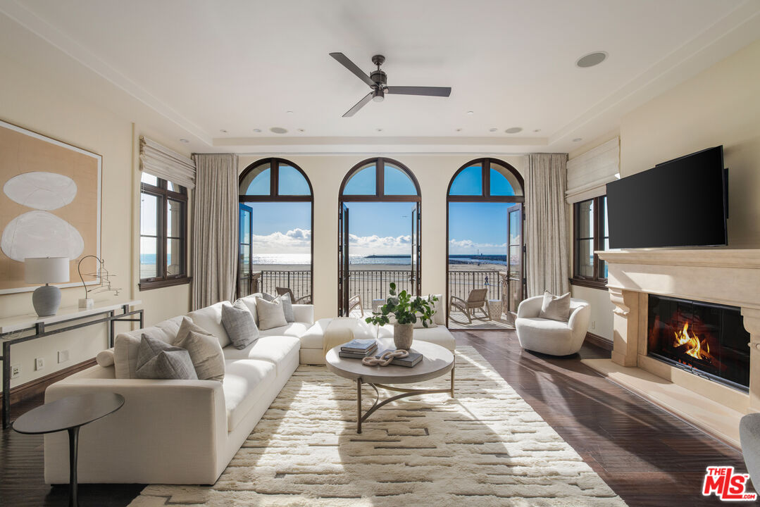 a living room with furniture fireplace and flat screen tv