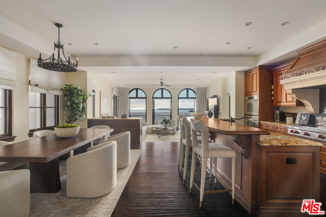 6209 Ocean Front Walk Playa del Rey, CA 90293 - Photo 11 of 57 a open kitchen with stainless steel appliances granite countertop a lot of counter space and wooden floors