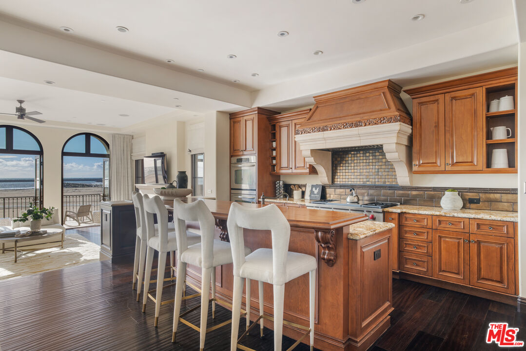 6209 Ocean Front Walk Playa del Rey, CA 90293 - Photo 14 of 57 a kitchen with lots of counter top space and dining table
