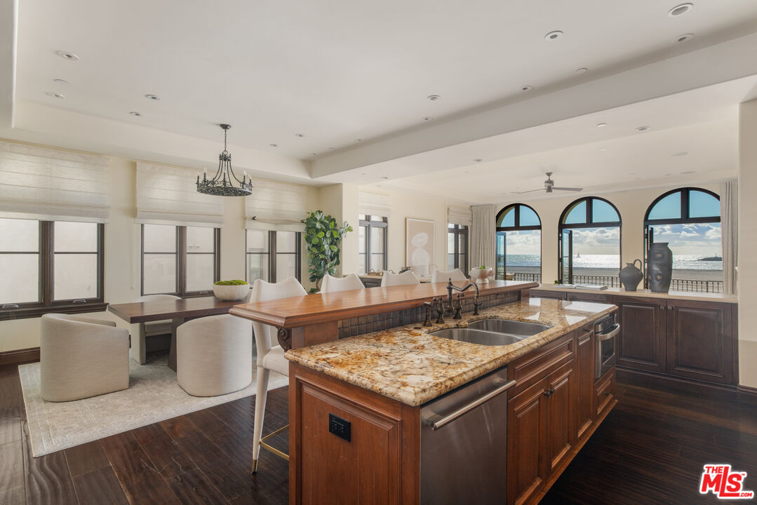 6209 Ocean Front Walk Playa del Rey, CA 90293 - Photo 15 of 57 a dining table with chairs and wooden floor