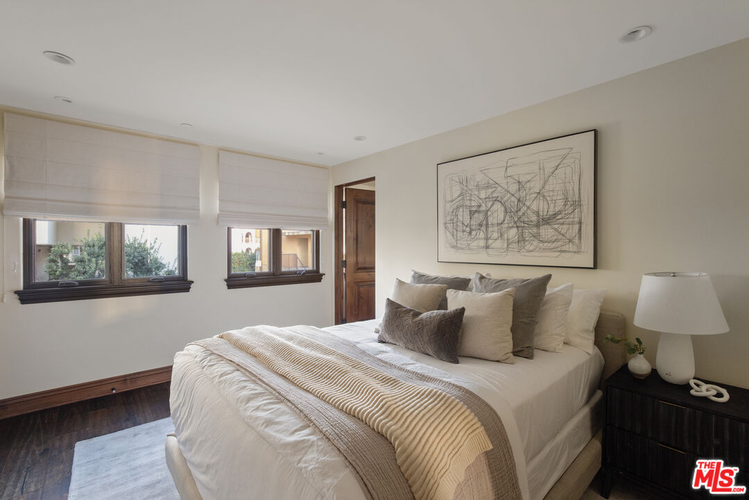 6209 Ocean Front Walk Playa del Rey, CA 90293 - Photo 21 of 57 a bedroom with a large bed and a window