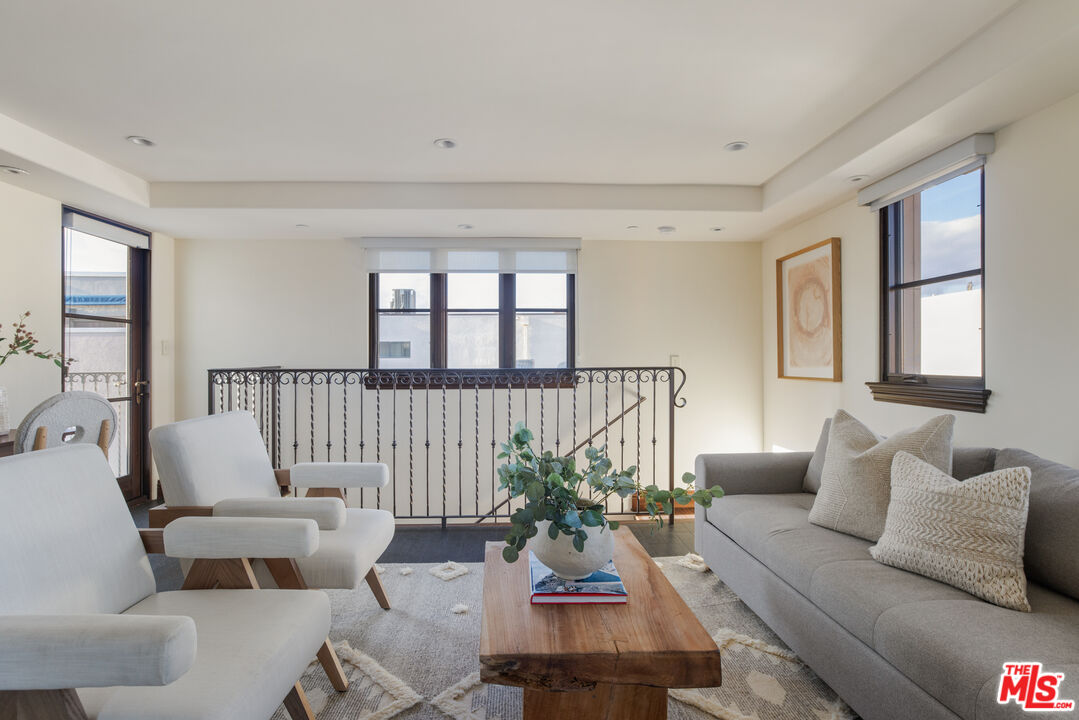 6209 Ocean Front Walk Playa del Rey, CA 90293 - Photo 26 of 57 a living room with furniture and a large window