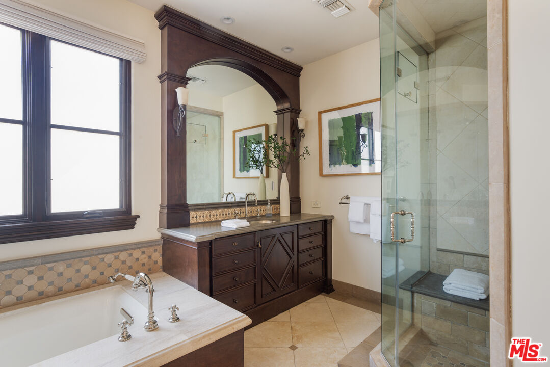6209 Ocean Front Walk Playa del Rey, CA 90293 - Photo 32 of 57 a bathroom with a tub sink and mirror