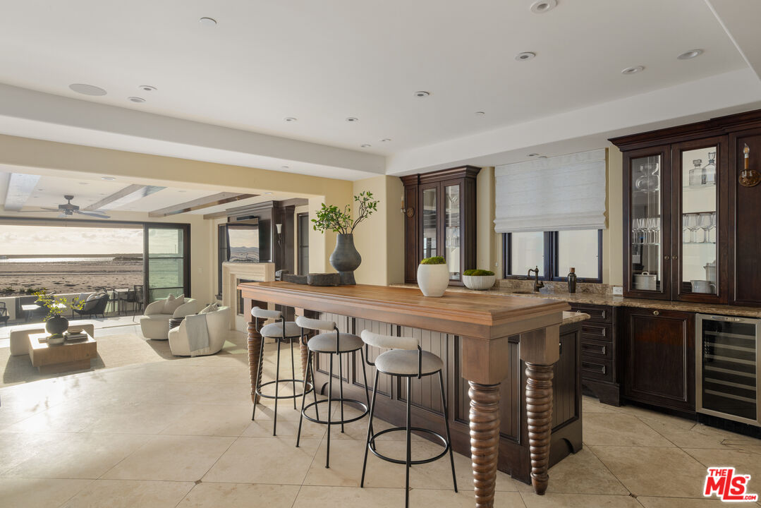 6209 Ocean Front Walk Playa del Rey, CA 90293 - Photo 42 of 57 a large kitchen with a table and chairs in it