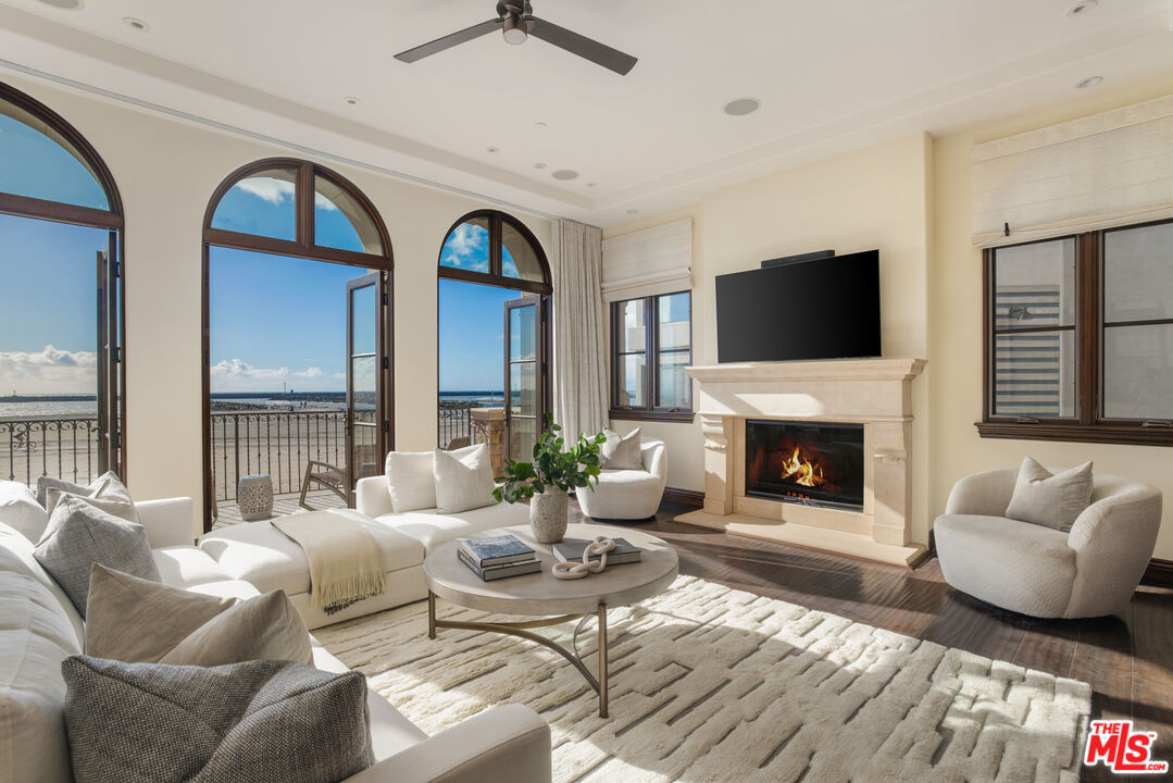 6209 Ocean Front Walk Playa del Rey, CA 90293 - Photo 8 of 57 a living room with furniture fireplace and a flat screen tv