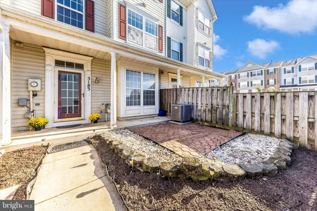 a view of a brick building with many windows