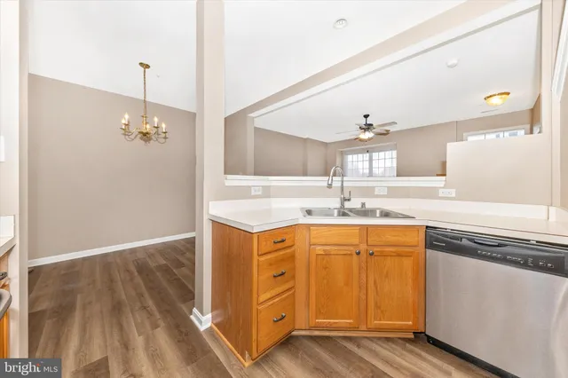 a bathroom with a granite countertop sink a large mirror and a vanity