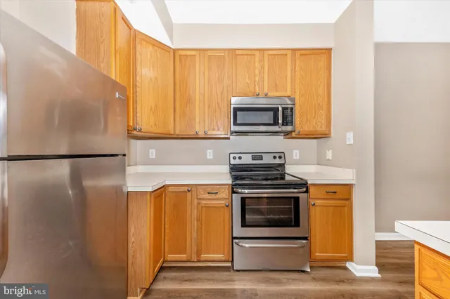 a kitchen with a stove microwave and refrigerator