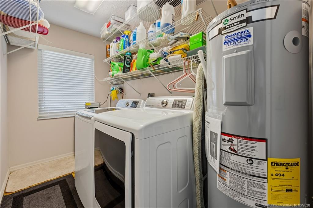 3160 Southeast Gran Via Way Stuart, FL 34996 - Photo 21 of 43 a utility room with dryer and washer