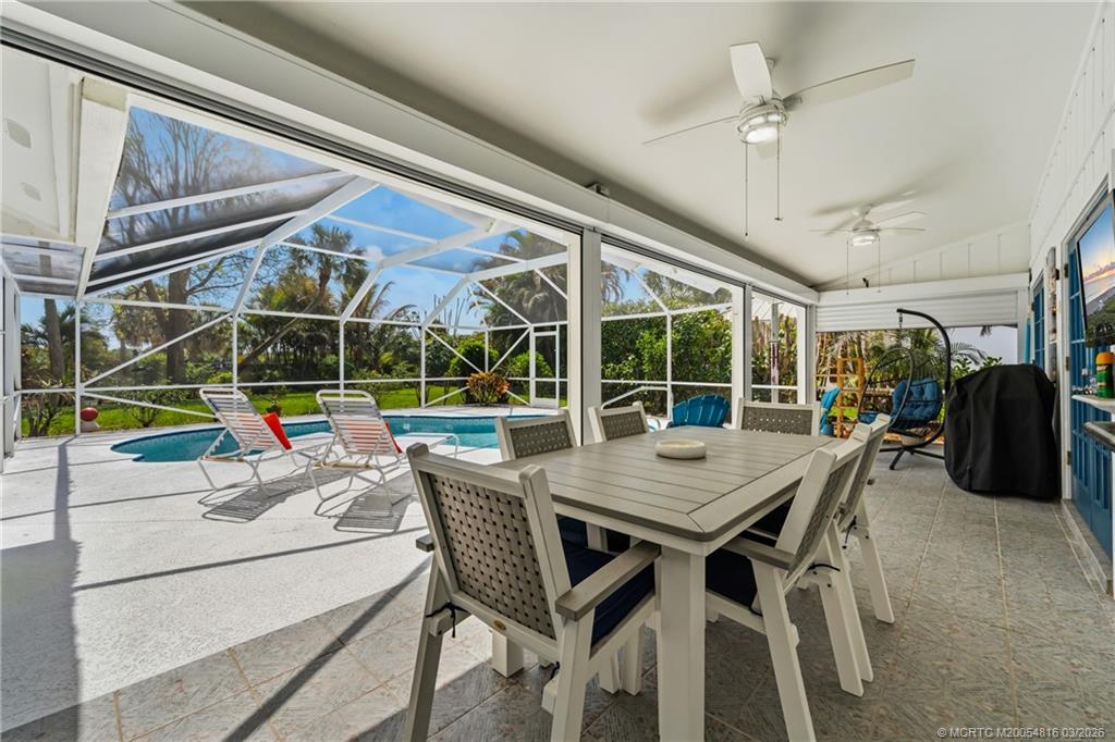 3160 Southeast Gran Via Way Stuart, FL 34996 - Photo 22 of 43 a view of a dining room with furniture window and outside view