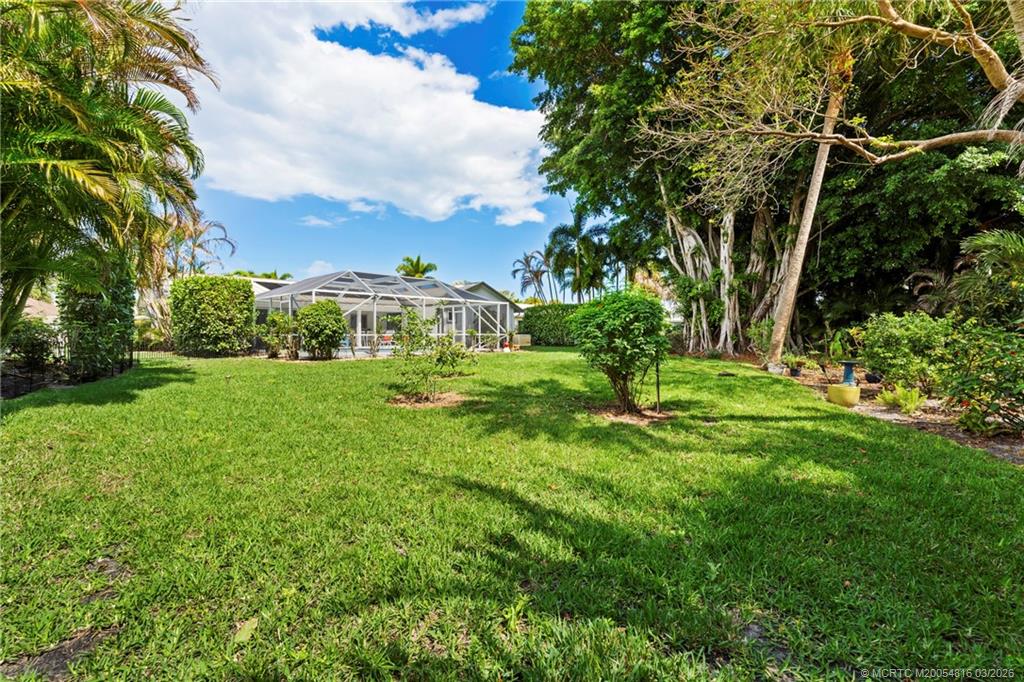 3160 Southeast Gran Via Way Stuart, FL 34996 - Photo 24 of 43 a view of a garden with a fountain
