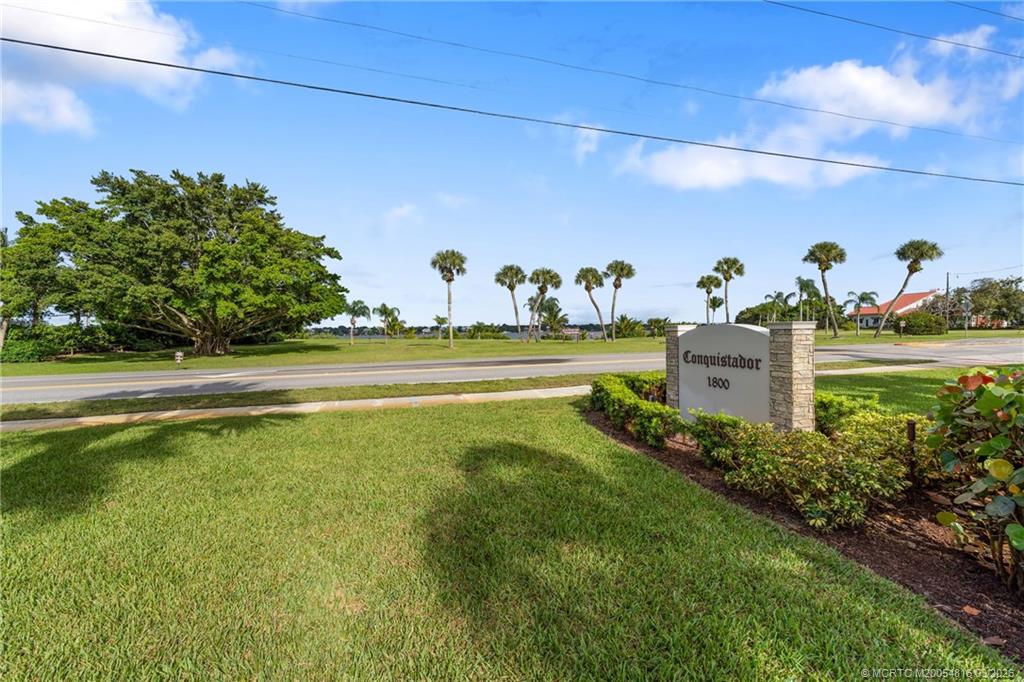 3160 Southeast Gran Via Way Stuart, FL 34996 - Photo 28 of 43 a view of a big yard with potted plants and large trees