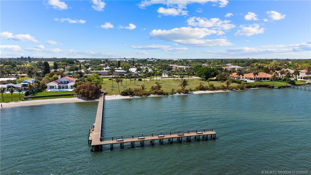 3160 Southeast Gran Via Way Stuart, FL 34996 - Photo 30 of 43 a view of a lake with a city