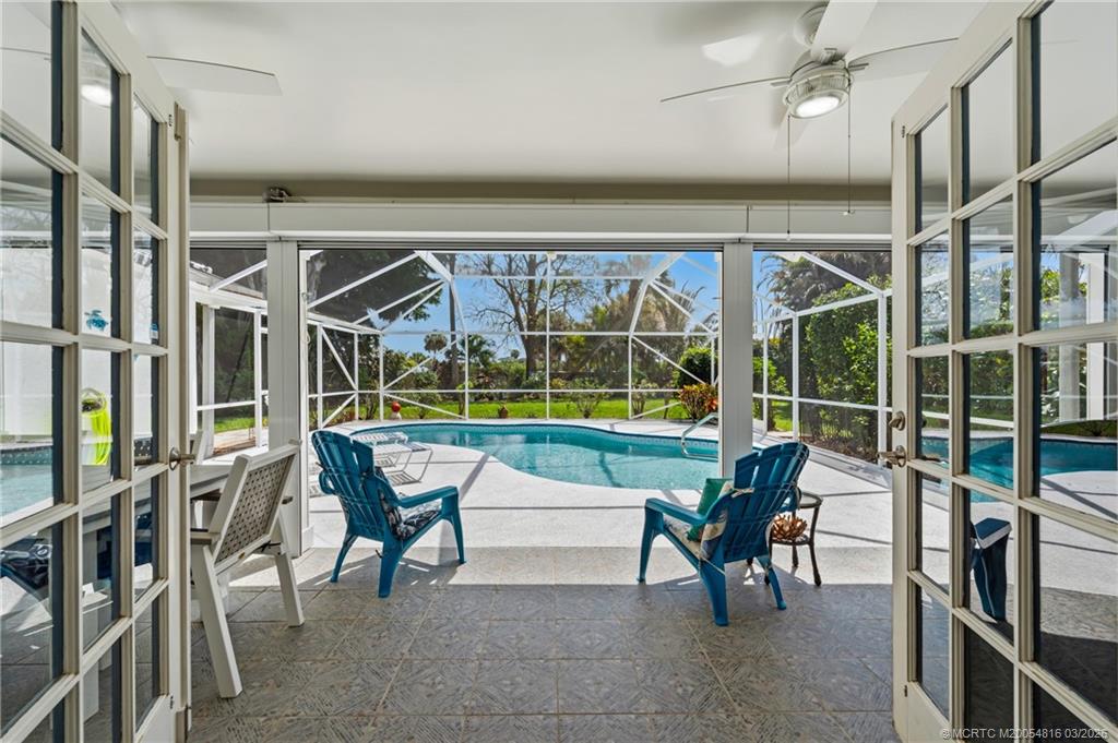 3160 Southeast Gran Via Way Stuart, FL 34996 - Photo 9 of 43 a view of a chairs and table in a patio