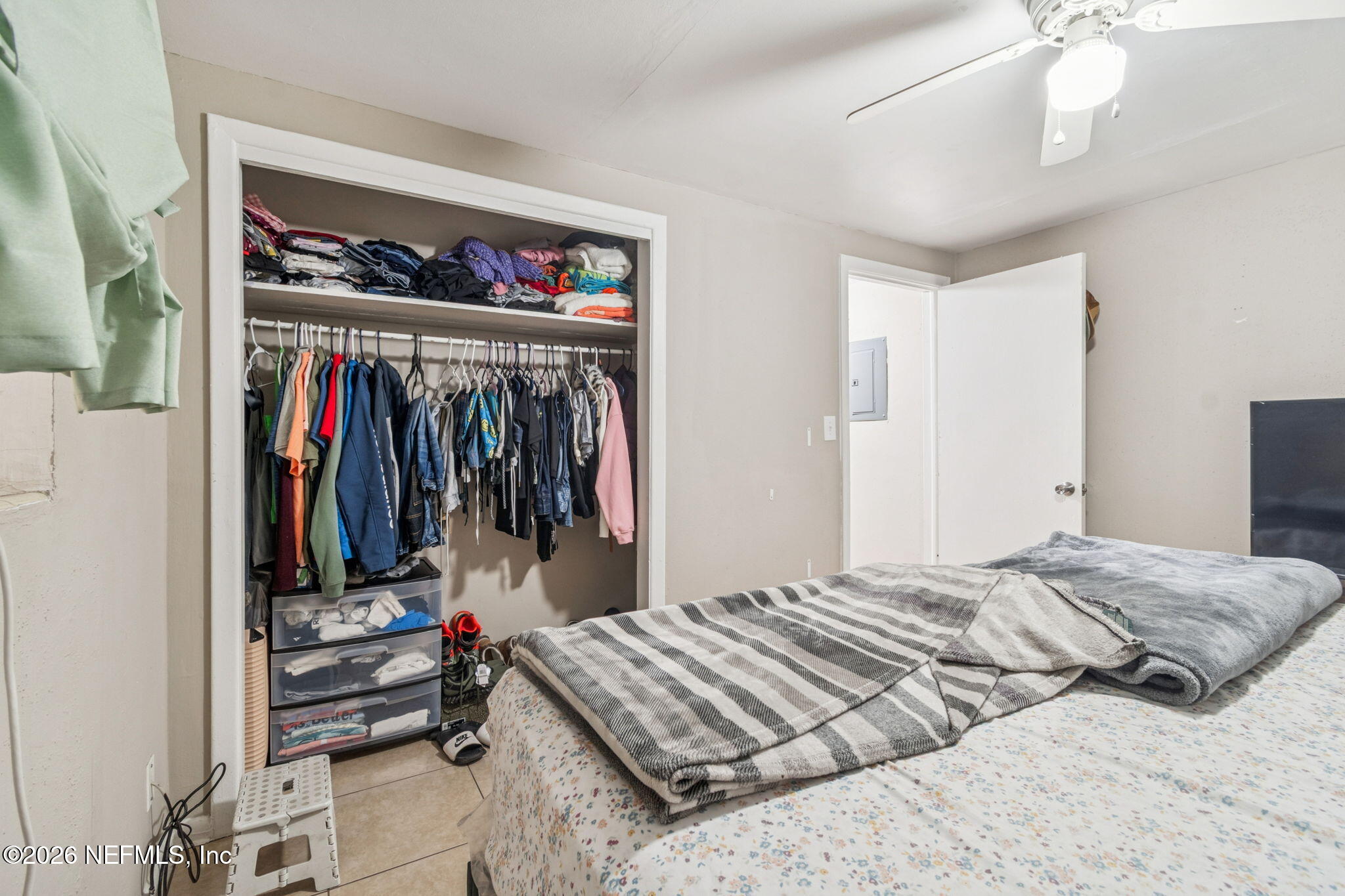 563 Eastport Road Jacksonville, FL 32218 - Photo 12 of 41 a bedroom with a bed and a window