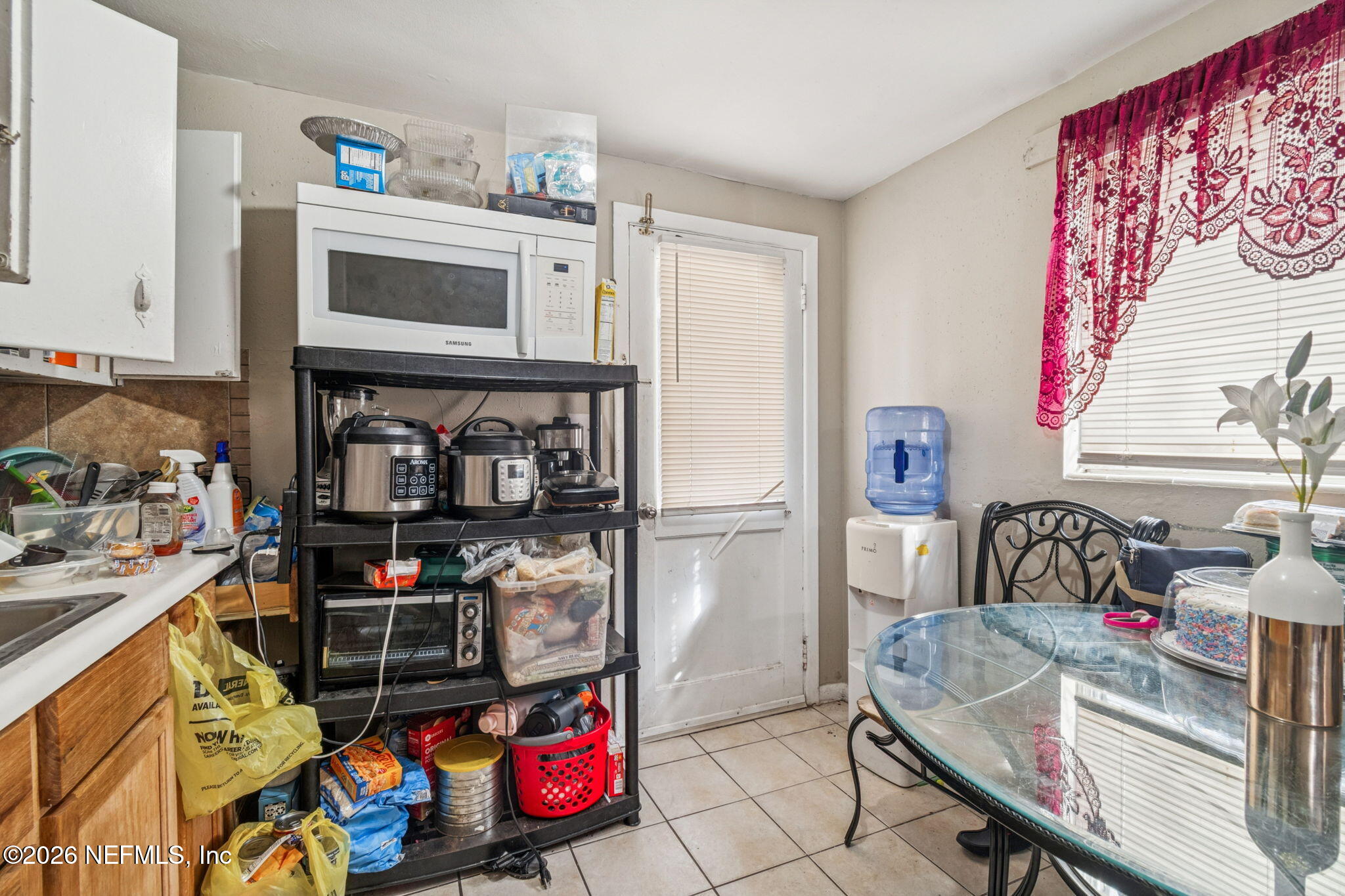563 Eastport Road Jacksonville, FL 32218 - Photo 21 of 41 a storage room with washer and dryer