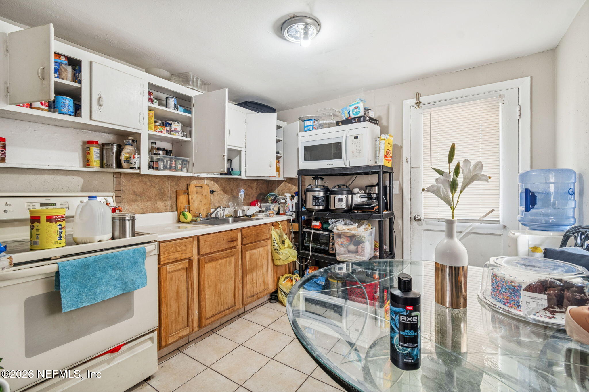 563 Eastport Road Jacksonville, FL 32218 - Photo 22 of 41 a kitchen with stainless steel appliances granite countertop a sink and cabinets